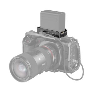 A black digital camera with a large lens shows the SmallRig 3018 NP-F Battery Adapter Plate Lite with a rectangular battery mounted on top. The camera is partially transparent to reveal the adapter plate and battery mount.