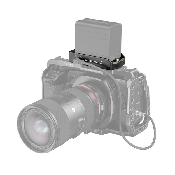 A black digital camera with a large lens shows the SmallRig 3018 NP-F Battery Adapter Plate Lite with a rectangular battery mounted on top. The camera is partially transparent to reveal the adapter plate and battery mount.