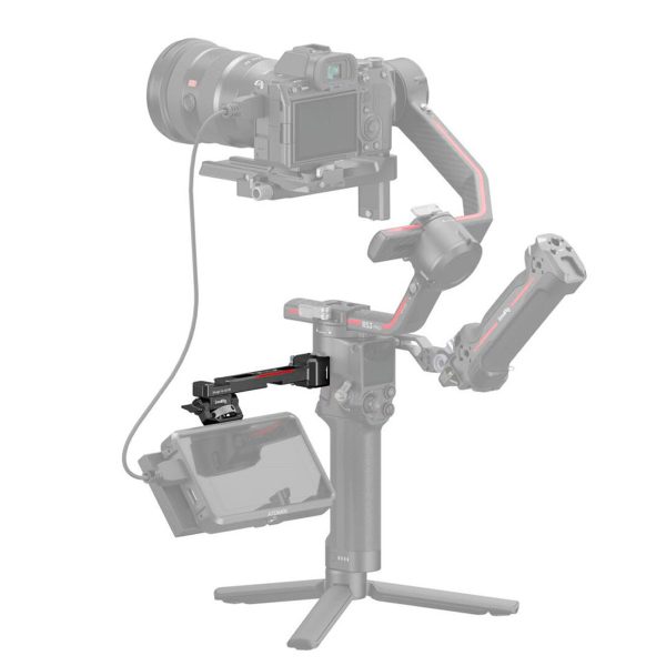The picture shows a professional camera with a handheld gimbal and tripod on which an external monitor is mounted using the SmallRig 3026B Monitor Mount for DJI Ronin. Some parts of the mount appear semi-transparent grey.
