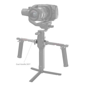 The camera is mounted on a handheld gimbal stabilizer with two side handles and is equipped with a grey SmallRig 3032 NATO Rail for the DJI Ron RS2/RSC2. The dual handle 3027 and accessories are shown in grey.