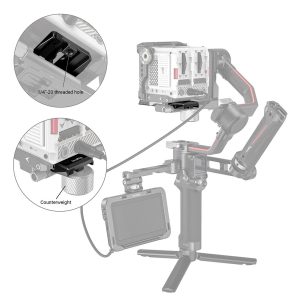 Camera on a handheld gimbal equipped with a SmallRig 3158 Manfrotto QR plate for DJI RS3/RS 3 Pro/RS 2/RSC 2/Ronin S, pictured with 1/4-20 thread and counterweight mount; the stabilizer also has an external display attached.