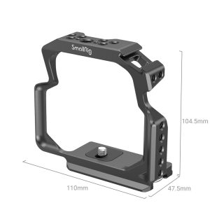 The SmallRig 3948 Camera Cage for OM System OM-1 is a black metal cage measuring 110mm x 104.5mm x 47.5mm with multiple mounting holes and a base screw to securely mount the camera.