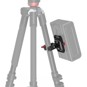 The SmallRig 2989 Battery Plate Mini V-Mount with Crab Clamp is pictured attached to the base of the tripod with red locking knobs, highlighting the battery mounting system. The tripod and battery are partially visible in the picture.