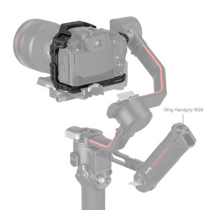 The Canon EOS R10 in the SmallRig 4004 Black Mamba Cage is mounted on a gimbal with a removable Sling Handgrip 3028. The camera and handgrip are clear, and the rest of the gimbal is softly faded.