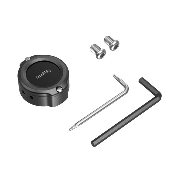 Black SmallRig 4149 Cage for Apple AirTag, with two screws on a white background, a silver Allen wrench and a black Allen wrench neatly arranged.