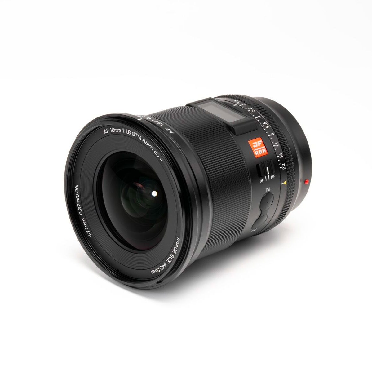 Black Viltrox AF 16mm f/1.8 lens for Sony E with RF 16mm F1.8 STM markings, AF/MF switch, textured focus and adjustment rings and red dot for focusing on a white background.