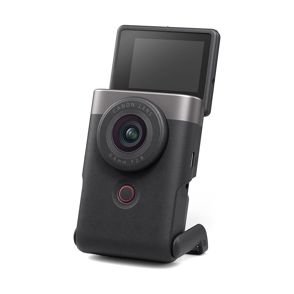 The Canon PowerShot V10 silver compact camera is a compact black camera with a wide-angle lens, swivel LCD screen and built-in corner support. There's a red button on the front, below the lens.