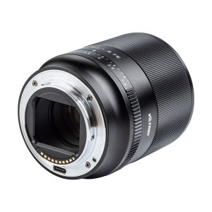 A close-up of the Viltrox AF 50mm f/1.8 lens for Sony E shows its metal lens mount, electronic contacts, aperture markings and textured focus ring against a white background.