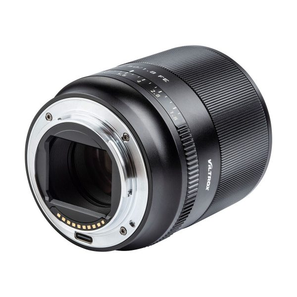 A close-up of the Viltrox AF 50mm f/1.8 lens for Sony E shows its metal lens mount, electronic contacts, aperture markings and textured focus ring against a white background.