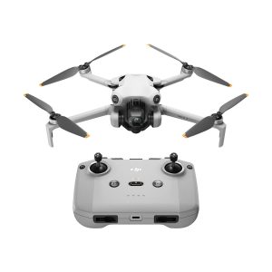 The grey DJI Mini 4 Pro drone with four propellers and a camera is pictured above a matching grey remote control with two joysticks and several buttons on a white background.