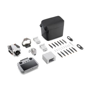 The DJI Mini 4 Pro Fly More Combo + RC2 Controller includes the drone, controller, two batteries, charger, propellers, cables, spare parts, accessories and a black carrying case - all neatly displayed on a white background.