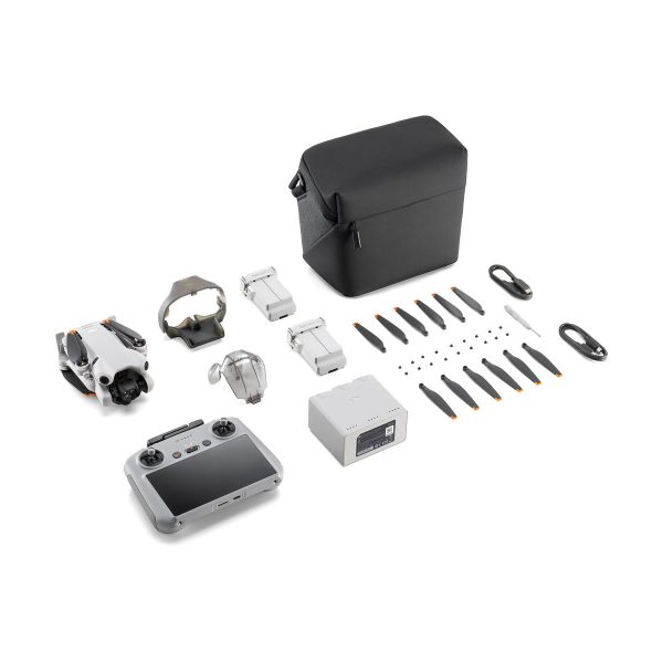 The DJI Mini 4 Pro Fly More Combo + RC2 Controller includes the drone, controller, two batteries, charger, propellers, cables, spare parts, accessories and a black carrying case - all neatly displayed on a white background.