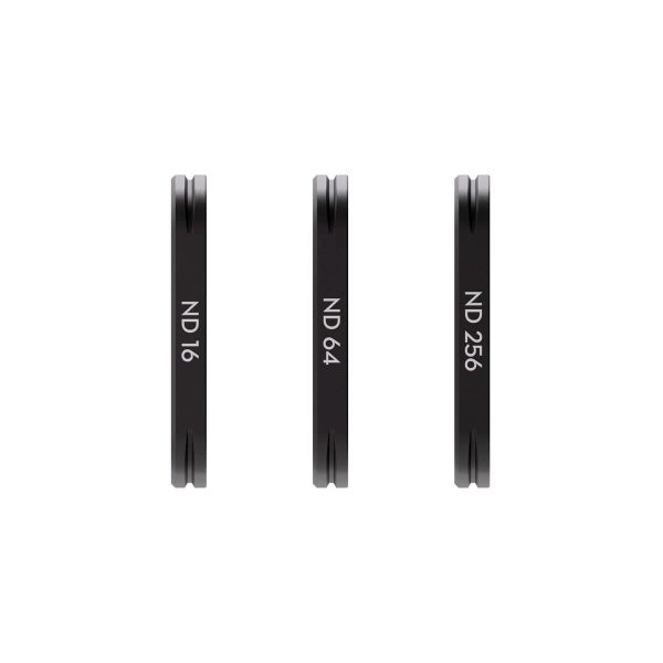 DJI_Osmo_3_008 Three thin, round DJI Osmo Pocket 3 magnetic filters (ND 16, ND 64 and ND 256) stand vertically next to each other on a white background.