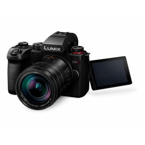The Panasonic Lumix G9 II + 12-60mm LEICA F2.8-4.0 Kit, black, features a large lens and flip-out LCD screen, angled to the right with a white background.