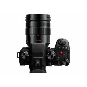 Top view of the Panasonic Lumix G9 II + 12-60mm LEICA F2.8-4.0 Kit, showing the control dials, buttons, grip and camera settings on the top panel. The attached zoom lens is marked "12-60mm.