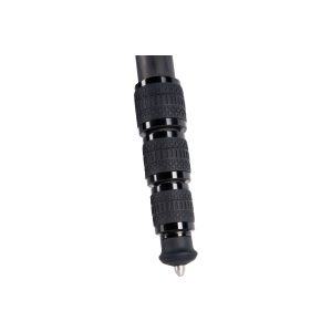 Close-up of the Sirui ST-224 carbon fibre tripod with textured grip rings and a sharp metal foot, isolated on a white background.