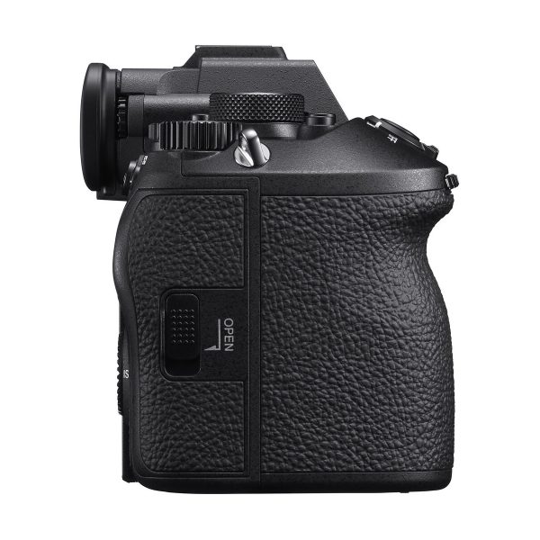 Side view of a black Sony A9 III system camera with textured grip, viewfinder, control buttons and OPEN-marked compartment, isolated on a white background.