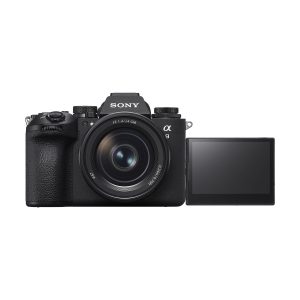 The Sony A9 III system camera is presented in black, with a large lens and a LCD screen that pulls out to the side against a white background.