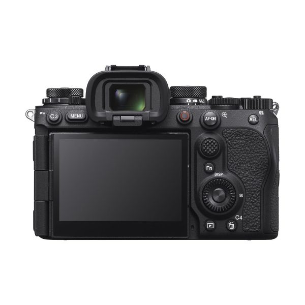 The Sony A9 III system camera has a black body with textured grips, a large LCD screen, viewfinder, multiple buttons, dials and clearly marked control labels on the back.