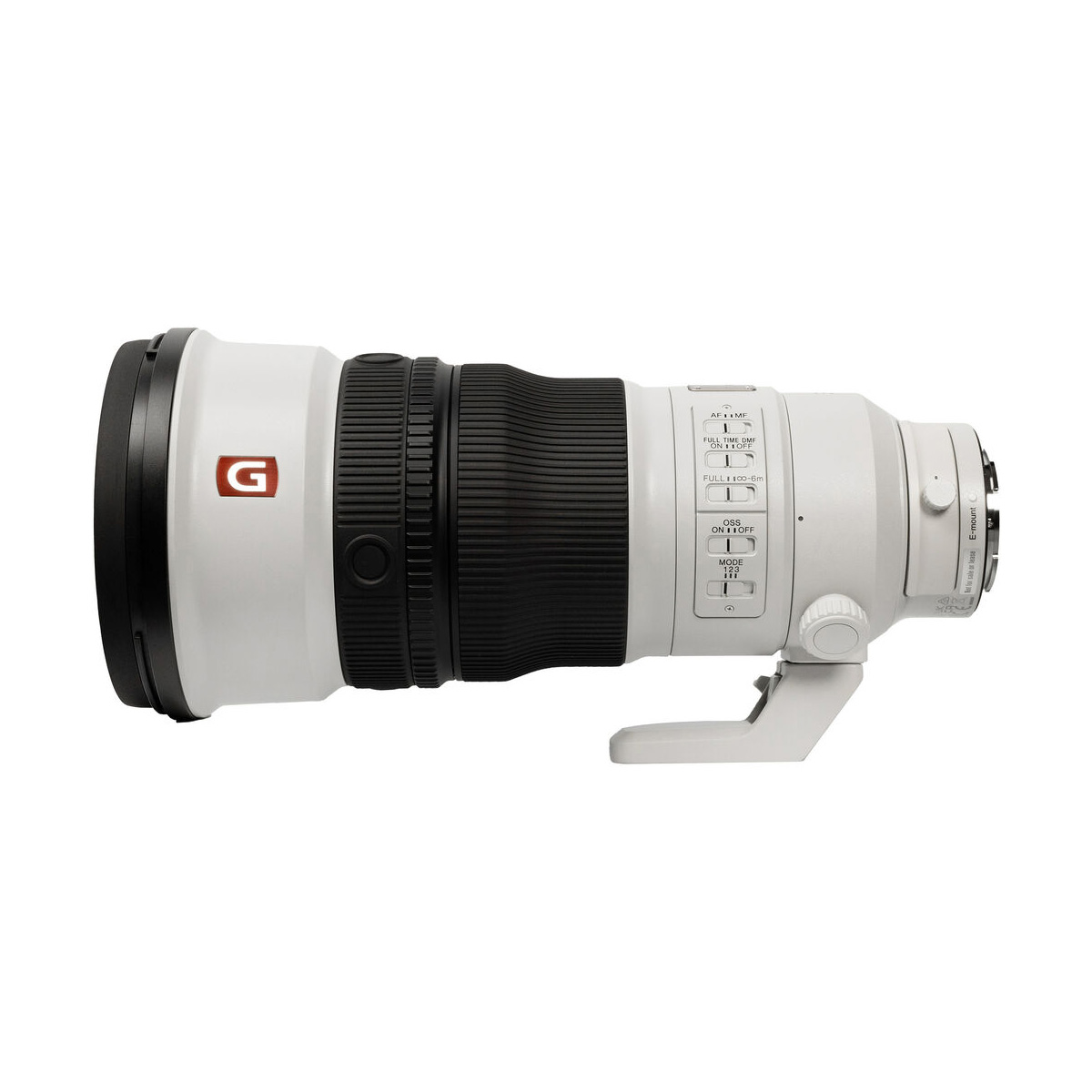 The Sony FE 300mm f/2.8 GM OSS lens is shown on its side, with a white body, black focus ring, control dials and a tripod mount on the bottom.