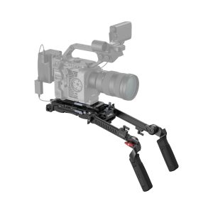 The SmallRig 4274 Shoulder Rig Kit Pro includes two black adjustable handles and mounting hardware attached under a digital video camera that is partially transparent.
