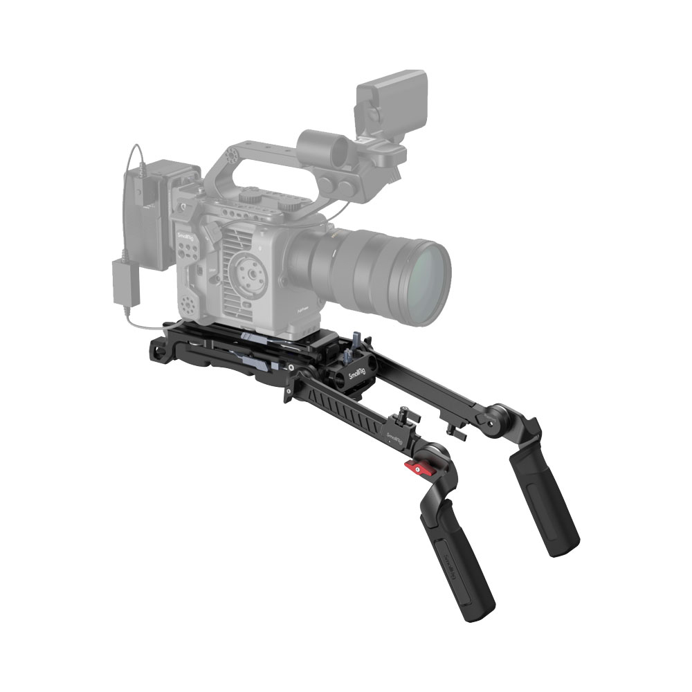 The SmallRig 4274 Shoulder Rig Kit Pro, with adjustable dual handles, is attached to a professional video camera that is partially transparent to highlight the attachment.