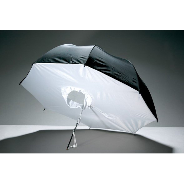 1326284054_138 Godox 84cm Umbrella Box White/Silver on kuvassa avattuna ja kyljellään. Siinä on musta ulkopinta, valkoinen sisäpinta ja keskellä pyöreä reikä, jossa on kiinnitysjohdot.