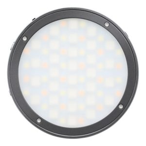 Godox R1 Mobile RGB LED -valaisin - Harmaa sisältää pyöreän, himmeän paneelin mustassa kehyksessä, jossa on neljä näkyvää ruuvia, ylhäältä päin kuvattuna valkoisella pohjalla.