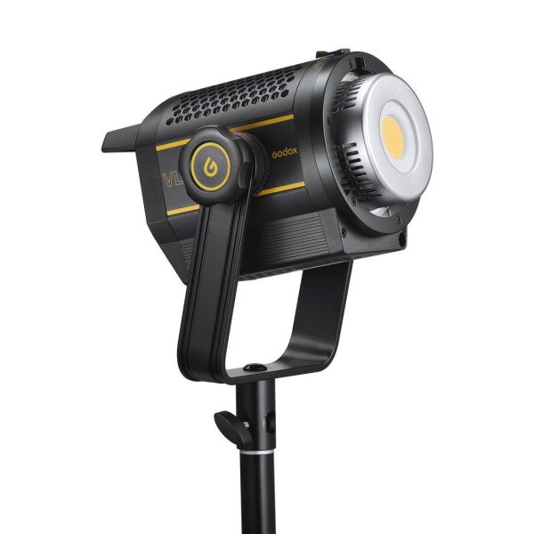 The black and yellow Godox VL200II LED video light is mounted on a tripod and displayed from the side, revealing a power button on the arm and a circular LED panel at the front.