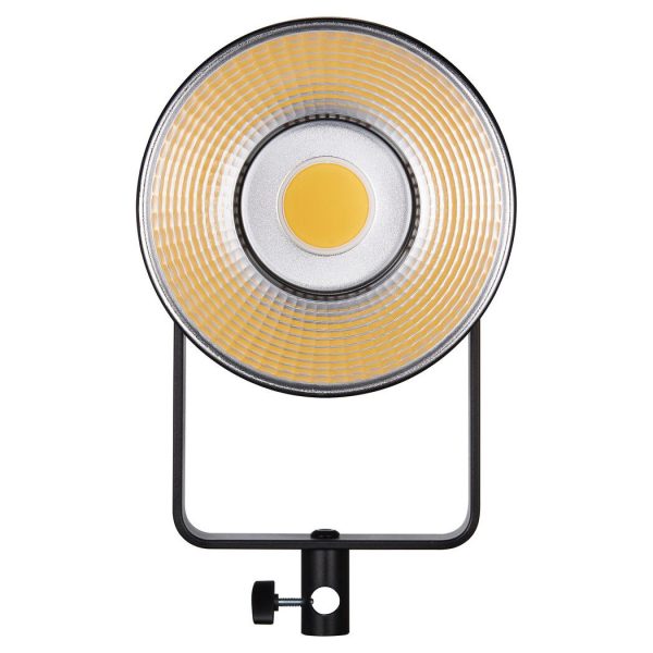 The Godox SL150III LED video light is a circular LED luminaire with yellow and silver reflector mounted on a black adjustable stand, front view in the picture.