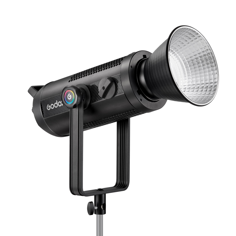 The Godox SZ300R Zoom RGB LED video light is a professional black studio light with a large silver reflector mounted on a metal base and a side control knob with coloured accents.