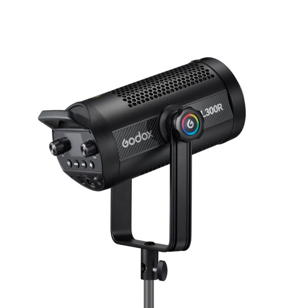 The black Godox SL300R RGB LED video light is mounted on a stand and features a colourful ring control knob and buttons on the back panel for adjustments.