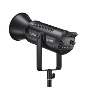 The black Godox SL300R RGB LED Video Light is mounted on a tripod and features a control panel, control knob and large cylindrical reflector.