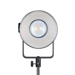 Close-up of the front view of the Godox SL300R RGB LED video light on a tripod, highlighting the textured reflector, central lamp and mounting hardware visible below.