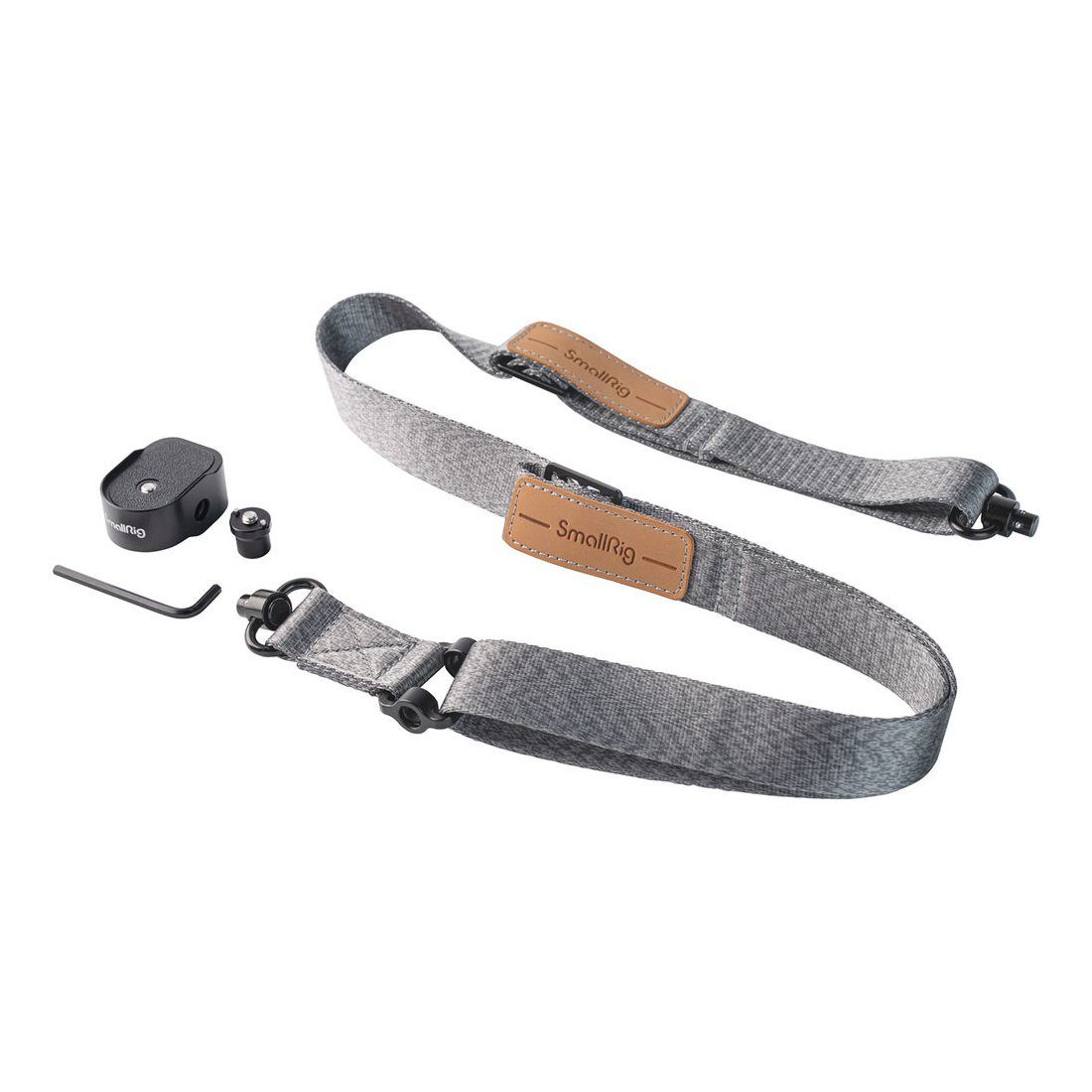 SmallRig 4118B Weight Reducing Shoulder Strap for DJI RS 3/RS 3 Pro/RS 2/RSC 2 is pictured with a grey fabric strap with brown leather accents, a black mounting plate, a screw, an Allen key and a small ring on a white background.