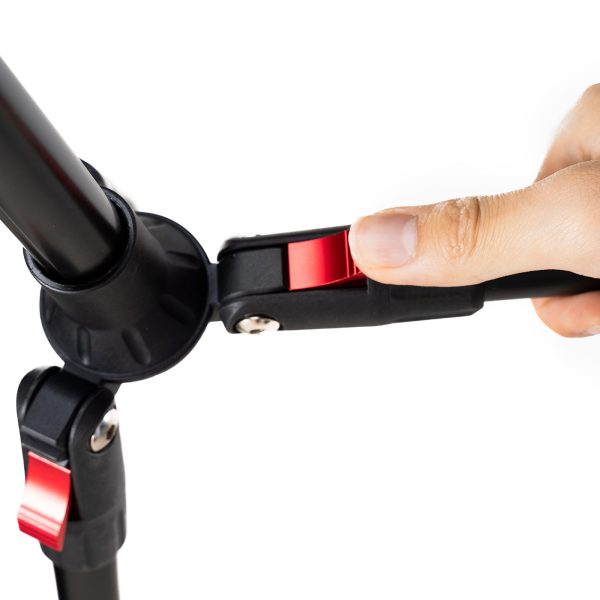 Close-up of a hand adjusting the red lever on the SmallRig 4363 Reverse Folding Live Streaming Stand Kit Encore PT 30, showing how to lock or unlock the stand's leg angle adjustment mechanism.