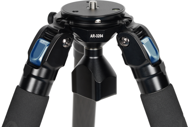 Close-up of the top of the Sirui AR-3204 carbon fibre tripod with black legs, blue locking levers and the model number AR-3204 in the middle.