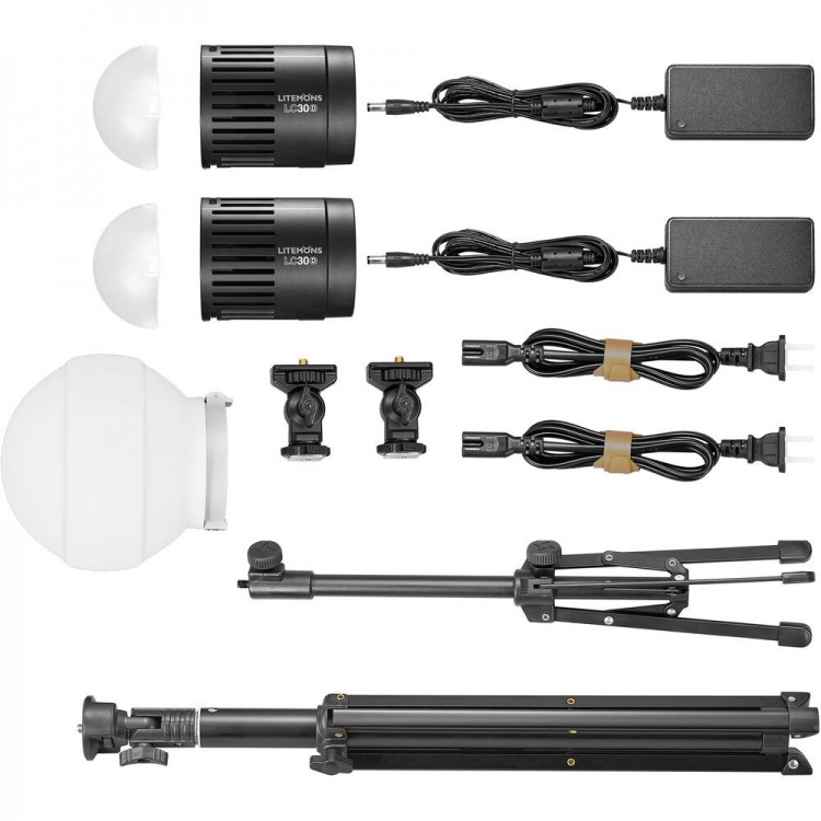The Godox Litemons LED LC30Bi Tabletop Bi-color Light Double Light Kit includes two LED lights with power adapters, light diffusers, mounting adapters, connecting cables and a foldable tripod stand, all displayed on a white background.