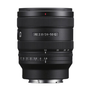 The black Sony FE 24-50mm f/2.8 G lens stands upright against a white background, with aperture and focal length markings visible. Get €100 cashback.