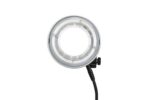 Lähikuvassa Godox R1200 Ring Flash Head for AD1200Pro -salamavalaisimesta näkyy sen pyöreä LED-muotoilu, läpinäkyvä ulkokotelo, keskiaukko ja sivuvirtajohto, kaikki valkoista taustaa vasten.