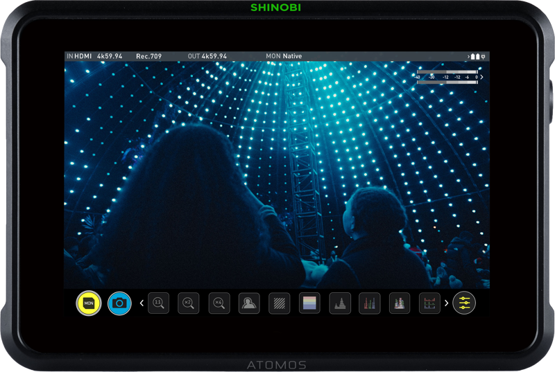 The ATOMOS Shinobi 7 - 7" 4K HDMI & SDI HDR Photo & Video monitor video shows people looking at a dome illuminated by geometric blue LED patterns, creating a stunning futuristic atmosphere.