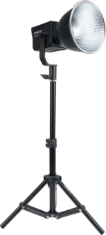 A black studio LED light with a large silver reflector is mounted on a NANLITE LS-60 base against a white background.