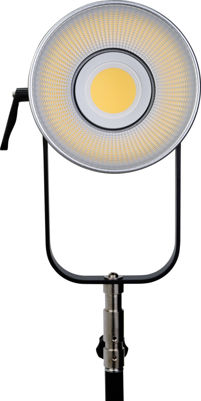 The NANLITE Forza 720 LED Spot with Trolley Mount is mounted on a black adjustable stand and features a circular design with a metal reflector and yellow centre against a white background.