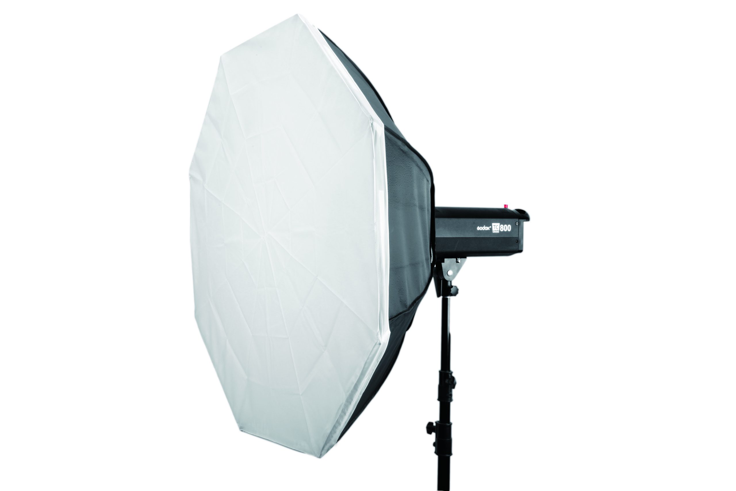 The Godox Octa Softbox 95cm is a large octagonal light diffuser mounted on a studio strobe and mounted on a black stand, ideal for professional photography.