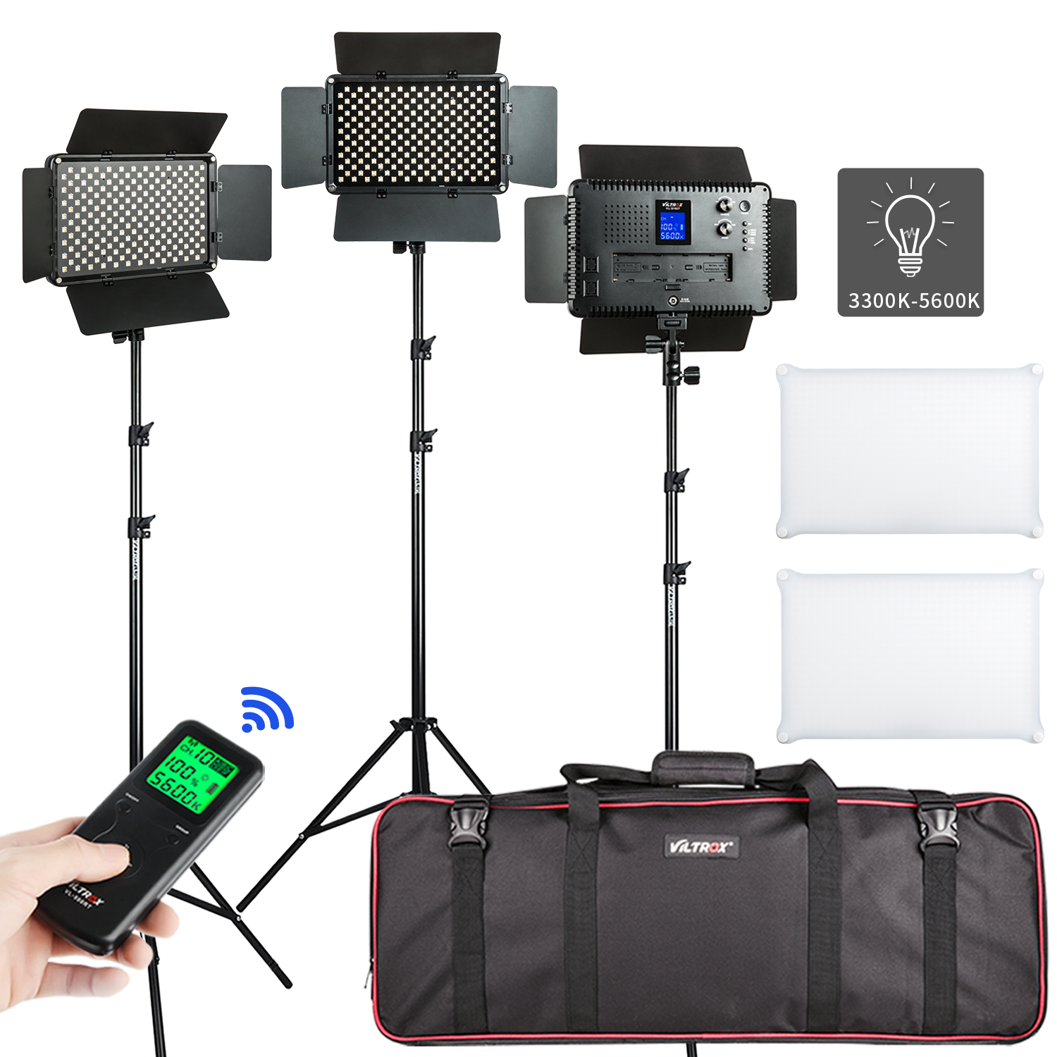 The Viltrox VL S192T LED Light Triple Kit includes three tripod lights, a remote controlled low beam, two white diffusers and a black carrying case. One luminaire displays a digital screen with adjustable colour temperature (3300K-5600K).