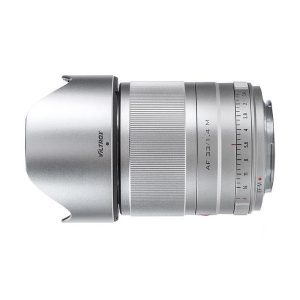 Silver Viltrox AF 33mm f/1.4 lens for Fuji X with brushed focus ring, aperture markings and attached hood, shot from the side on a white background.