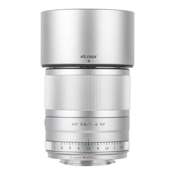 Silver Viltrox AF 56mm f/1.4 Fuji X lens The Fuji X lens is shown upright with a ribbed focus ring, aperture markings and X-mount marking on the front.