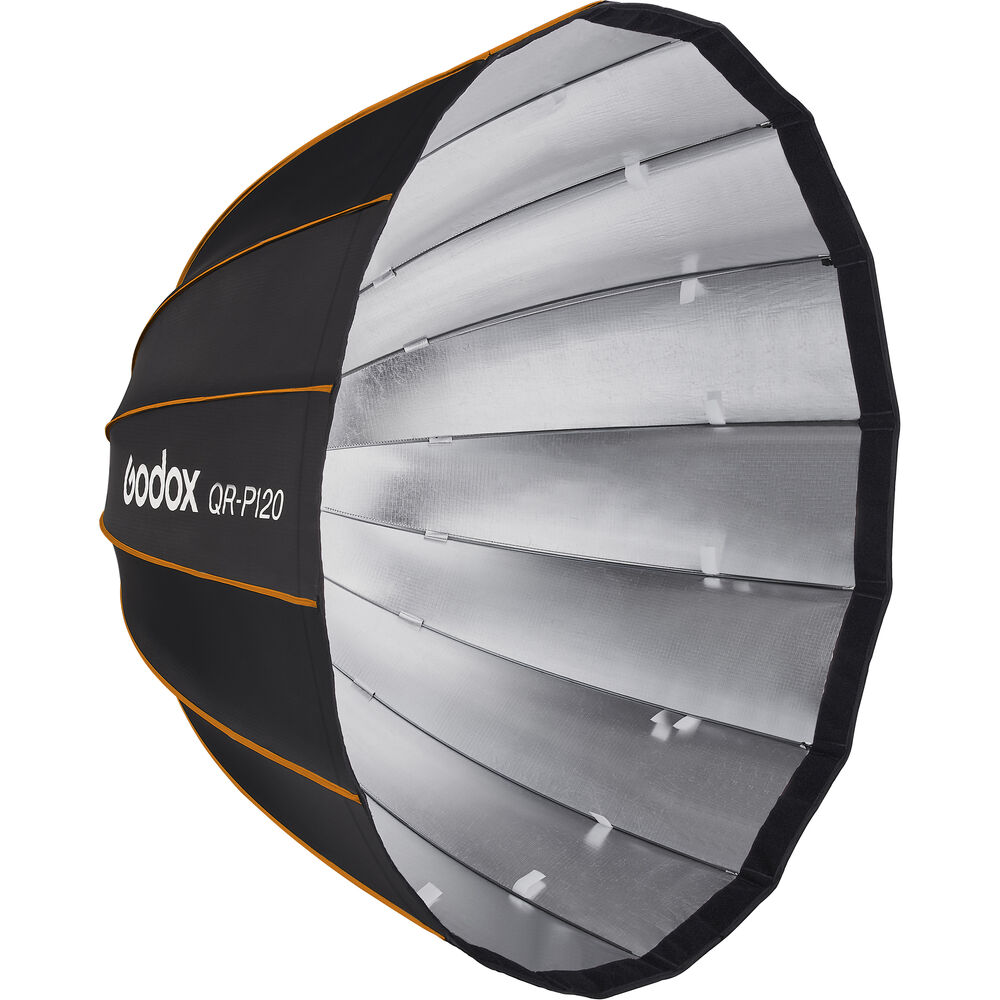 Godox Quick Release Parabolic Softbox QR PF120 Profoto on suuri, pyöreä softbox, jossa on hopeinen sisäpuoli, musta ulkopuoli, oranssi reunus ja valkoiset tangot - ihanteellinen studiovalaistuksen hajottamiseen.