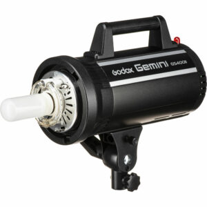 Godox GS400II on musta studiostroboskooppivalaisin, jossa on sylinterimäinen salamaputki, yläkahva ja kiinnityskannatin pohjassa.