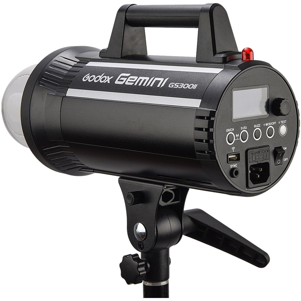 1637157295_898 The black Godox GS300II studio strobe is mounted on a stand, with the control panel, knobs and display on the back.